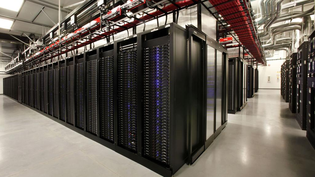 A spacious room filled with neatly arranged rows of servers, humming with technological power.