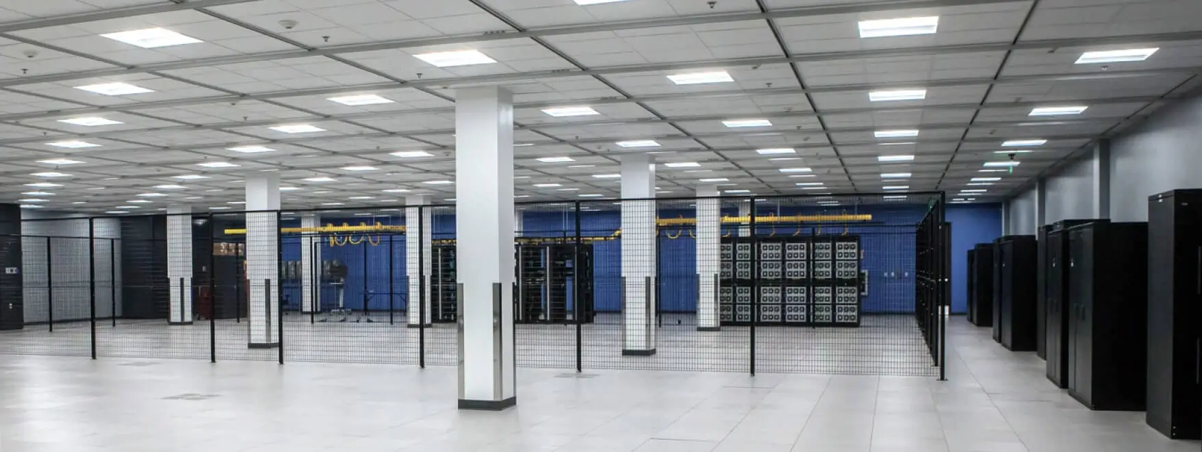 A spacious room with numerous servers.