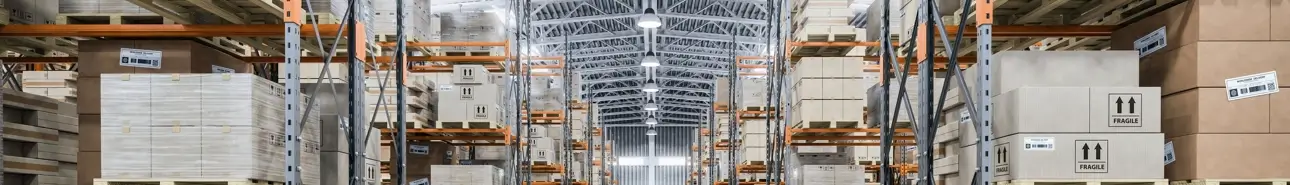 A well-organized warehouse filled with numerous boxes and shelves for efficient storage.